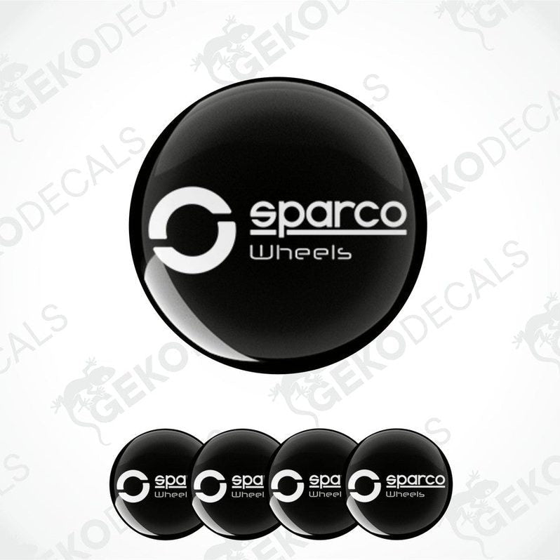 A set of four black vinyl stickers with the SPARCO brand logo, designed for use as car decals.
