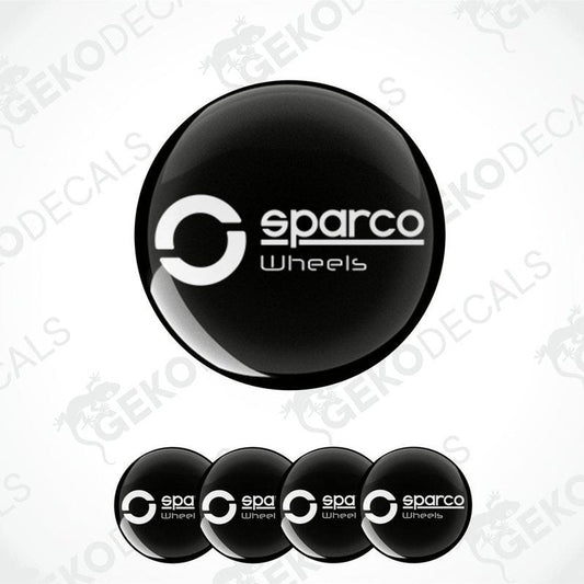 A set of four black vinyl stickers with the SPARCO brand logo, designed for use as car decals.