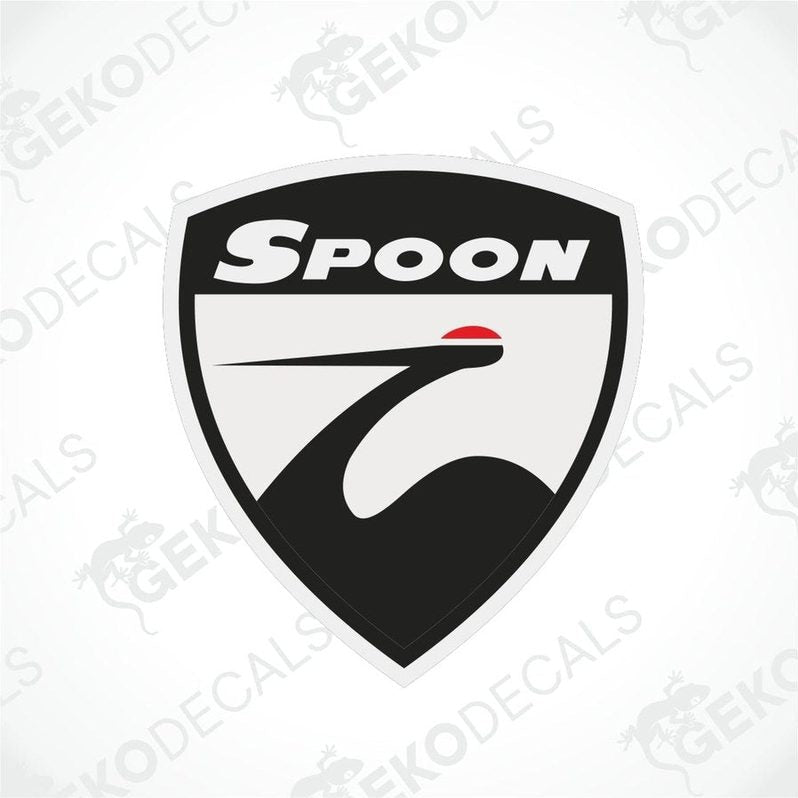 A car sticker with the brand name 'Spoon' written on it, predominantly in black and white with a distinctive graphic element.