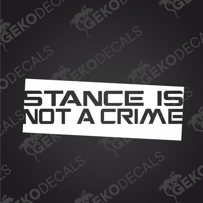 A black and white image of a decal with the text 'STANCE IS NOT A CRIME' in bold capital letters.
