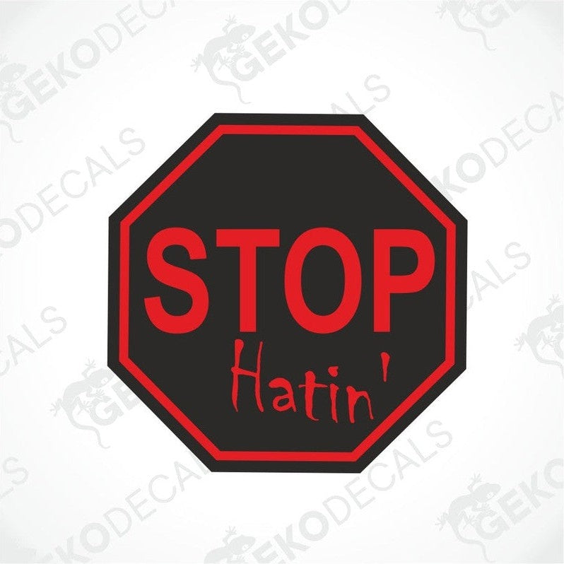 A red and black car decal with the text 'STOP HATIN' written in white.