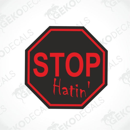 A red and black car decal with the text 'STOP HATIN' written in white.