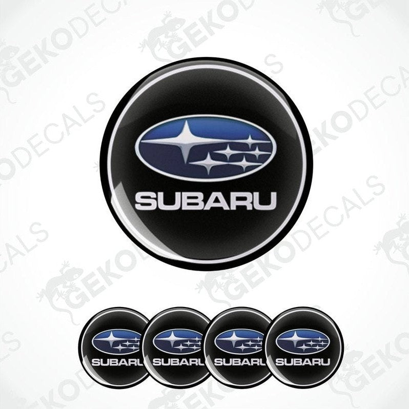 A set of four black vinyl stickers with the Subaru brand logo in white.