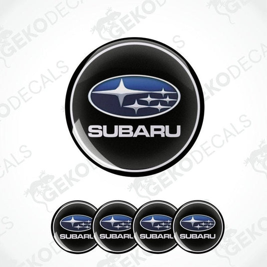A set of four black vinyl stickers with the Subaru brand logo in white.