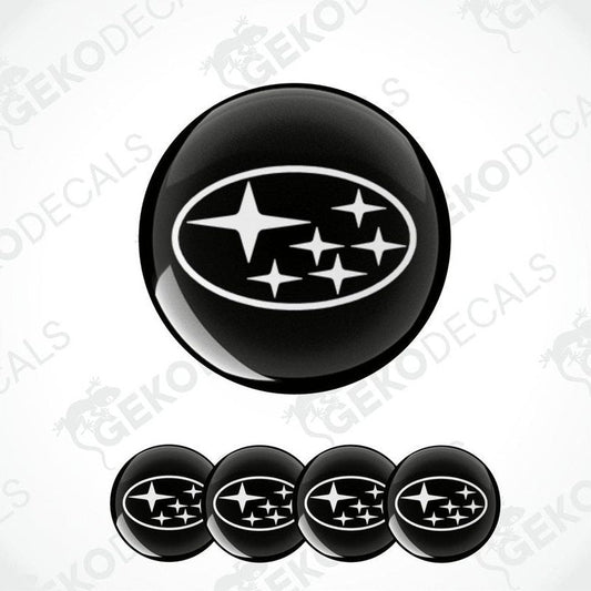 A set of four black vinyl stickers with a star pattern and the word 'SUBARU' printed on them.