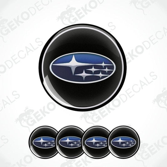 A set of four black vinyl stickers with a blue and white Subaru logo.