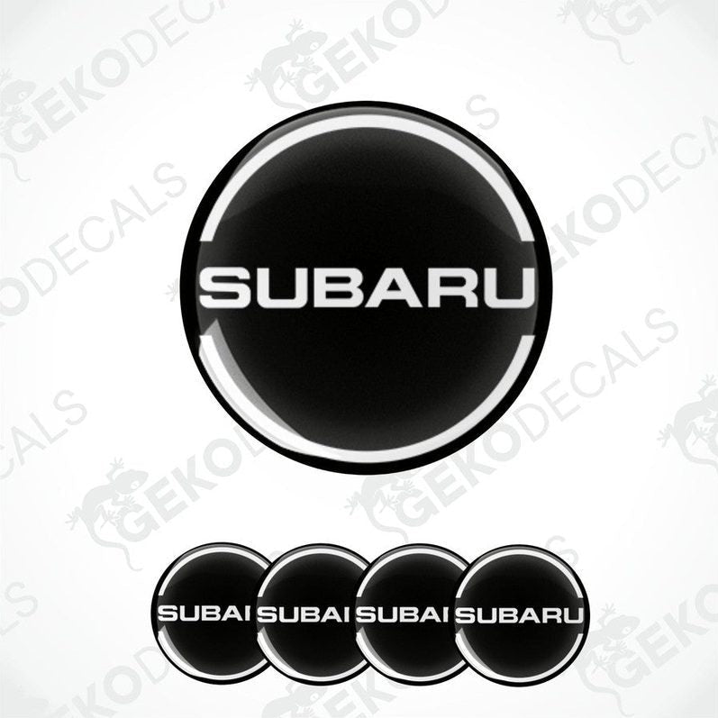 A set of four black vinyl stickers with the word 'SUBARU' and a logo depicting a wheel, placed against a white background with the Gecko Decals logo.