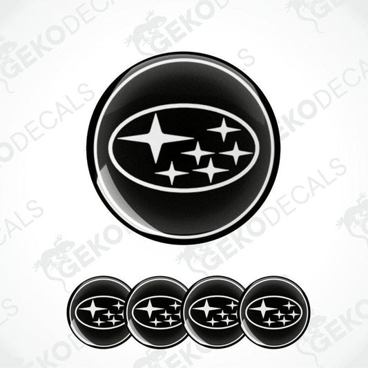 A set of four black vinyl stickers with a star and the logo of the Subaru car brand.