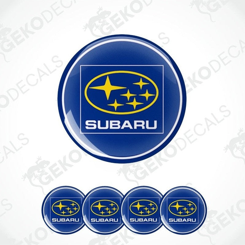 A set of four blue vinyl stickers with the Subaru brand logo and stars around it.