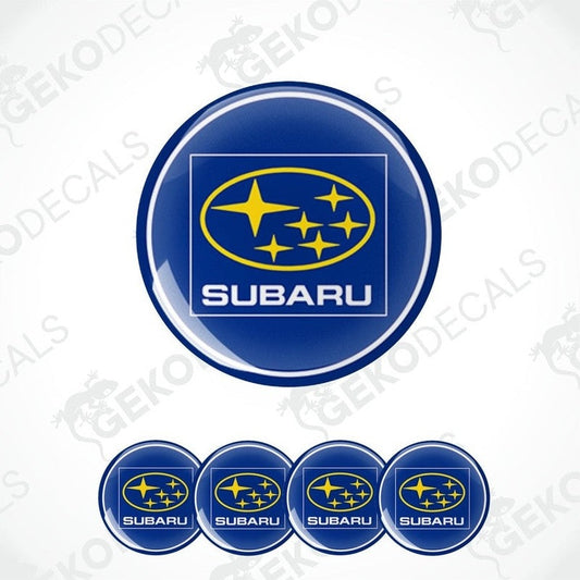 A set of four blue vinyl stickers with the Subaru brand logo and stars around it.