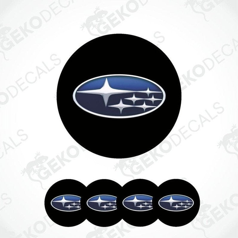 A set of four black vinyl stickers with a blue and white Subaru logo.