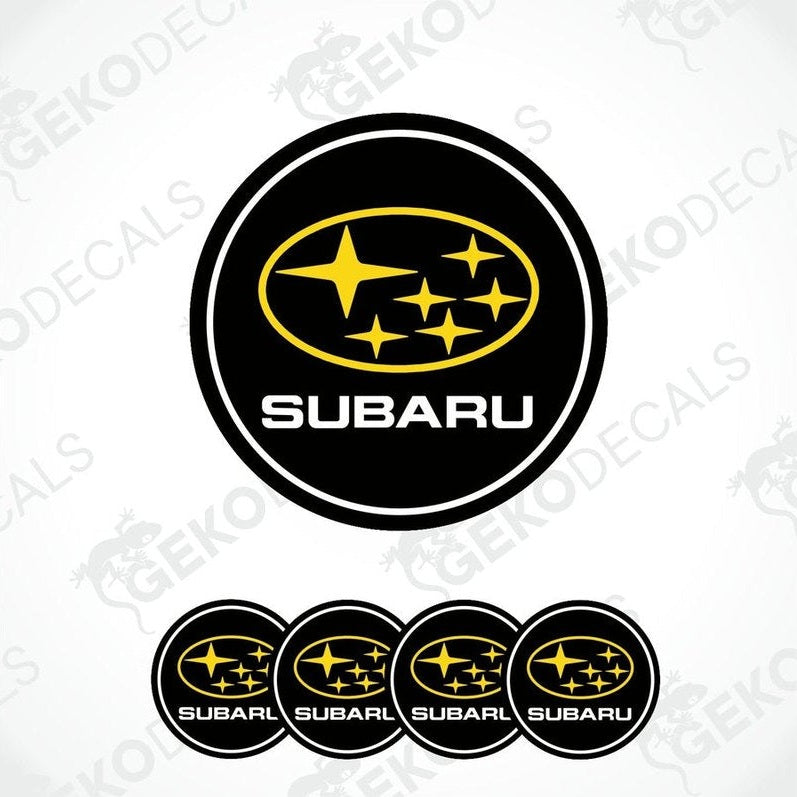 A set of four black, yellow, and white vinyl stickers with a geometric design, featuring the word 'SUBARU' in bold letters.