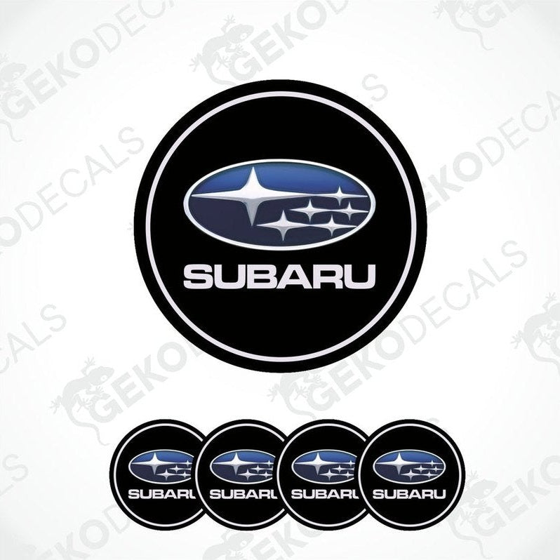 A set of four black vinyl stickers with the Subaru brand logo in white.