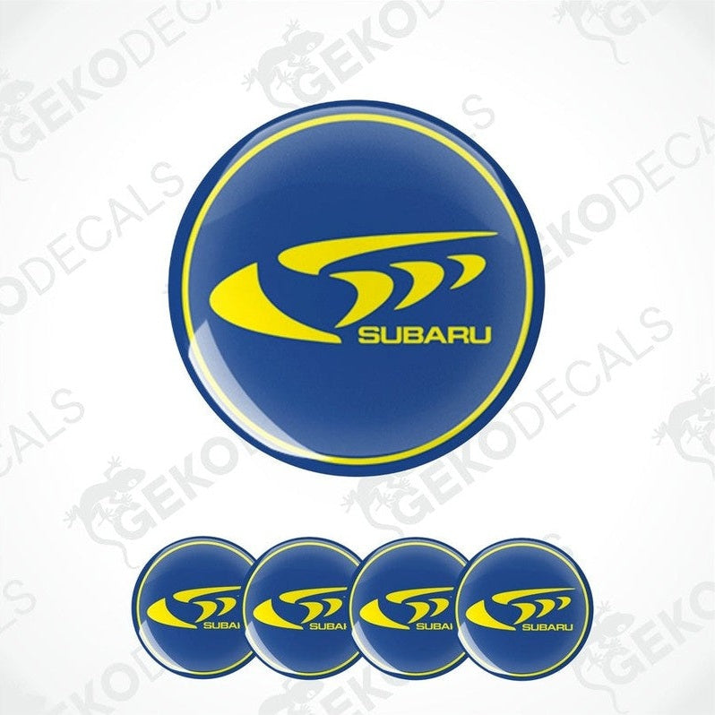 A set of Subaru branded vinyl decals with a blue background and yellow Subaru logo.