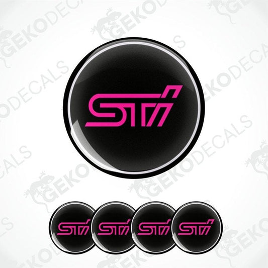 A set of four black vinyl stickers with the word ' SUBARU STI' in pink, intended for use on vehicle wheels.