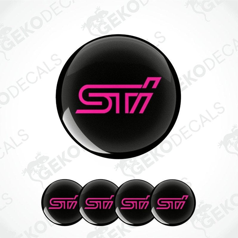 A set of four black vinyl stickers with the word ' SUBARU STI' in pink, intended for use on vehicle wheels.