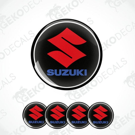 A set of four black vinyl stickers with the SUZUKI brand logo in red and blue.