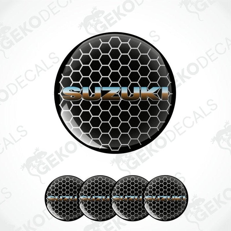 A set of vinyl decals with a polyurethane coating, featuring the Suzuki logo and a hexagonal pattern in black, silver, and gray colors.