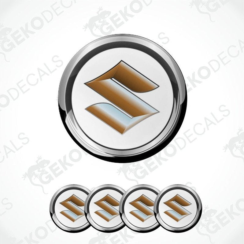 A set of four silver-colored vinyl stickers with a dome shape and the Suzuki logo in the center.