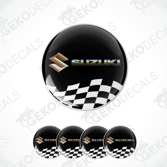 A set of four black vinyl stickers with the SUZUKI brand logo and a checkered pattern.