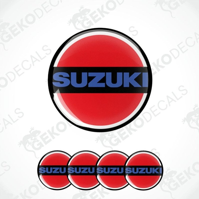 A set of four red, white, and blue vinyl stickers with the word 'SUZUKI' on them, arranged in a circular pattern with a Gecko Decals logo at the bottom.