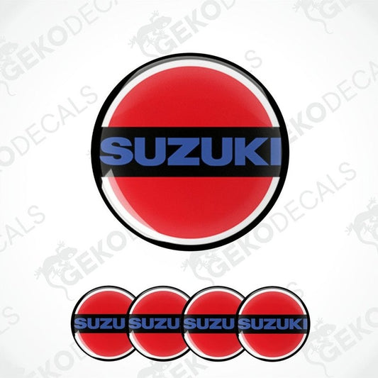 A set of four red, white, and blue vinyl stickers with the word 'SUZUKI' on them, arranged in a circular pattern with a Gecko Decals logo at the bottom.