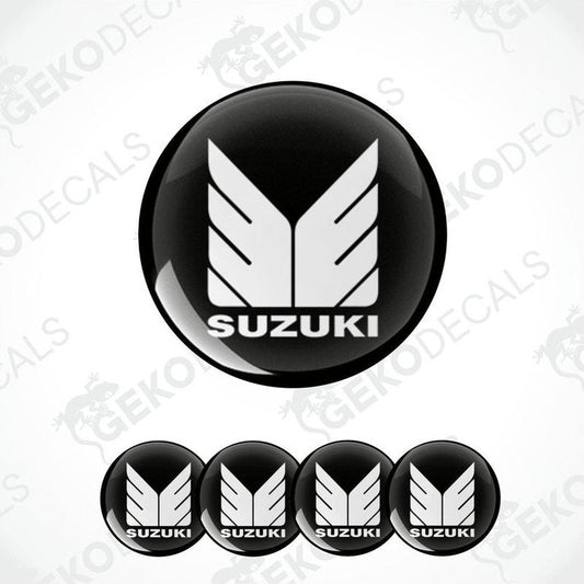 A set of four black vinyl stickers with the SUZUKI brand logo design.