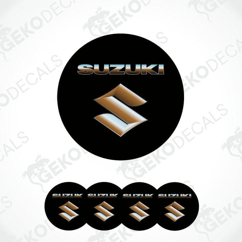 A set of black, gold, and silver SUZUKI branded vinyl decals with a polyurethane coating, designed for use on vehicles.