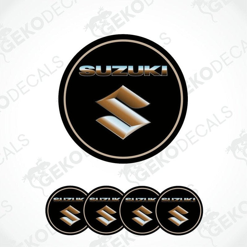 A set of black, silver, and gold colored vinyl decals with the SUZUKI logo, designed for use on vehicles.