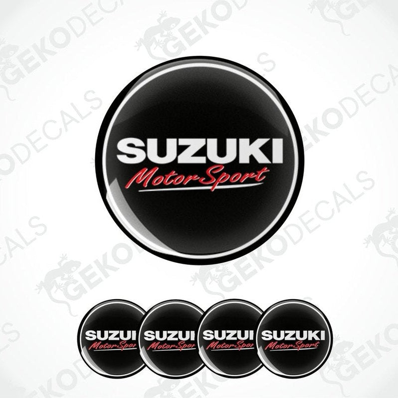 A set of four black vinyl stickers with the text 'SUZUKI MOTORSPORT' in red and white.