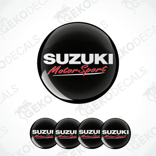 A set of four vinyl decals with polyurethane coating, featuring the 'Suzuki MotorSport' logo in black, white, and red colors.