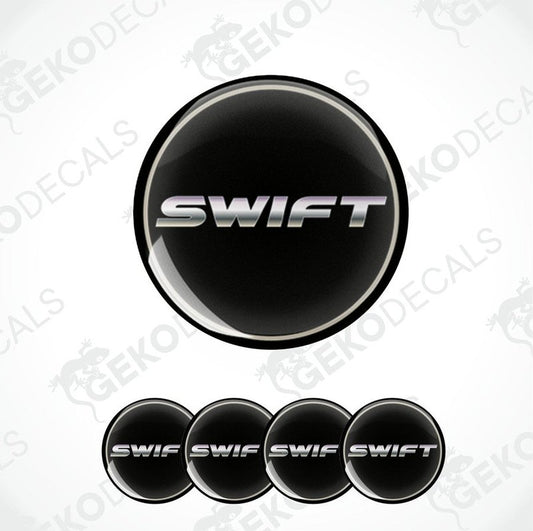 A set of black vinyl decals with the text 'SWIFT' on them, typically used as car wheel caps or stickers.