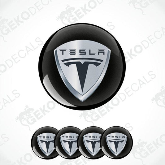Set of four black and silver Tesla brand vinyl decals with a polyurethane coating.