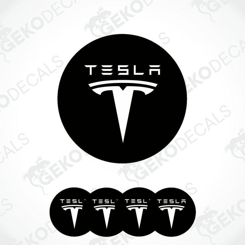 Set of four black and white vinyl decals with the Tesla logo, intended for use on a vehicle's wheels and other surfaces.