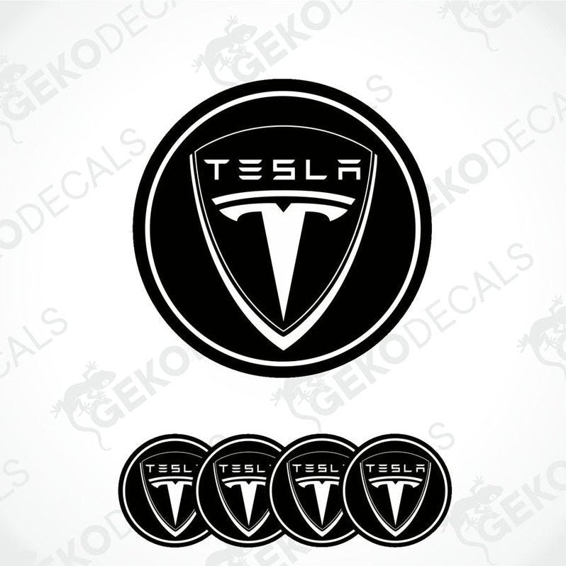 Set of four black and white vinyl decals with the Tesla logo, designed for use as car wheel and wheel cap stickers.