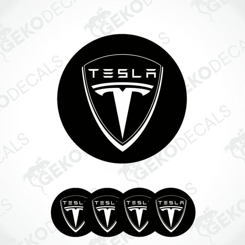 A set of four black vinyl stickers with a Tesla logo design.