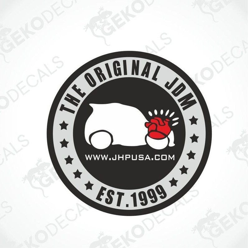 Round sticker in black and gray, text The original JDM Est.1999. In the middle is a white car silhouette, under the hood is a red heart image.