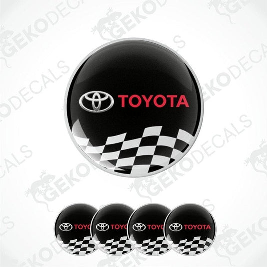 A set of four black vinyl stickers with the Toyota logo and a checkered pattern.