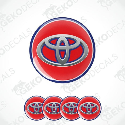 A set of four red, white, and blue car decals with the TOYOTA logo.