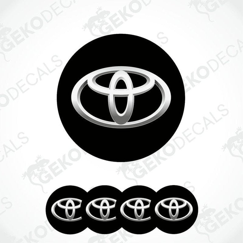 A set of four black vinyl stickers with a Toyota logo, designed for use as car decals.