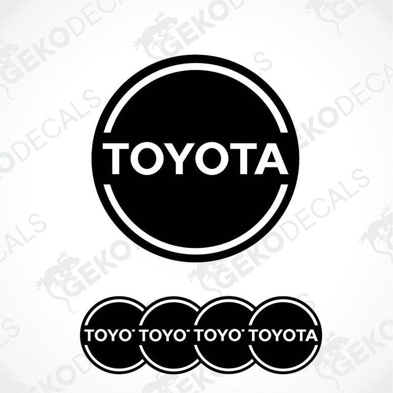 A set of black vinyl decals with the TOYOTA logo, including one large decal and four smaller ones with the text 'TOYOTA' arranged in a pattern.