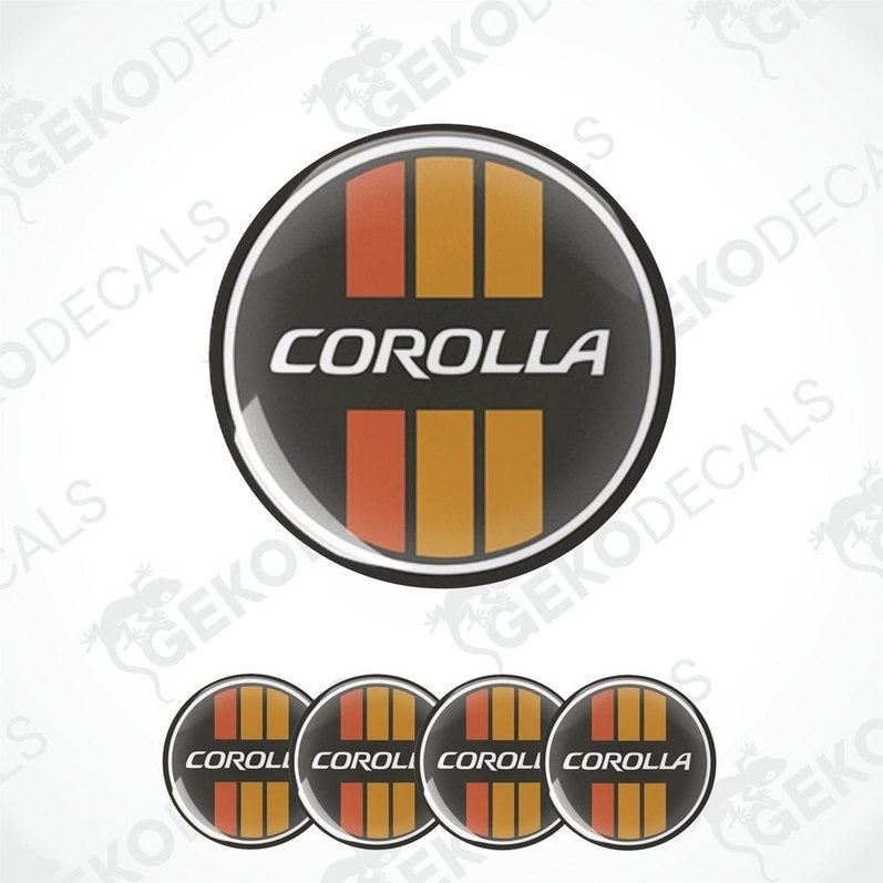A set of four vinyl decals for a TOYOTA COROLLA, featuring a black circular design with orange and gray stripes and the text 'COROLLA' in capital letters.