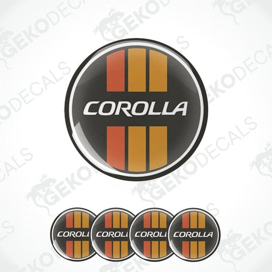 A set of four vinyl decals for a TOYOTA COROLLA, featuring a black circular design with orange and gray stripes and the text 'COROLLA' in capital letters.