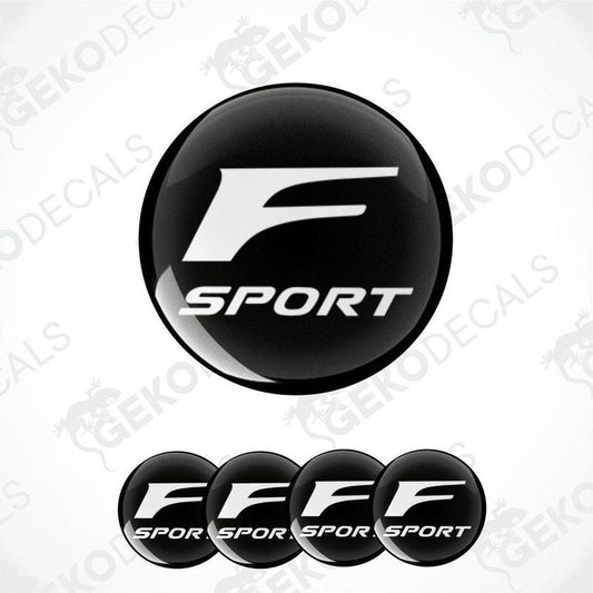 A set of four black vinyl stickers with the TOYOTA F SPORT logo printed on them.