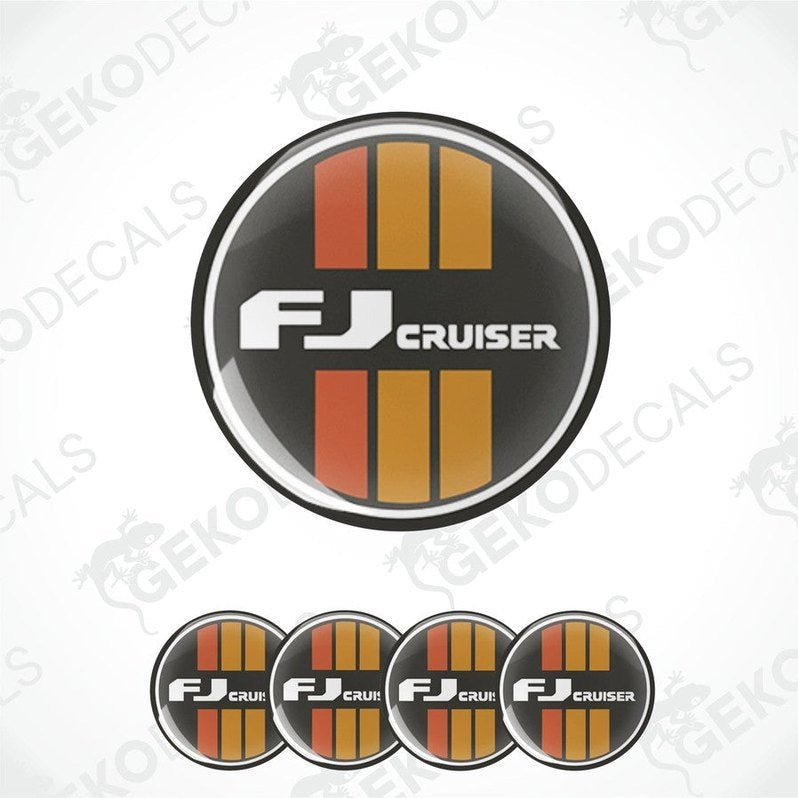 A set of round car decals for a TOYOTA FJ CRUISER, featuring the vehicle's name in white lettering with orange and gray stripes on a black background.