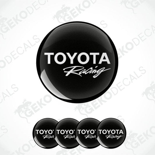 A set of four black vinyl stickers with the TOYOTA RACING logo, designed for use on car wheels or caps.