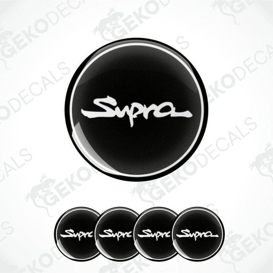 A set of four black vinyl stickers with the word 'TOYOTA SUPRA' written on them, designed for use as car decals.