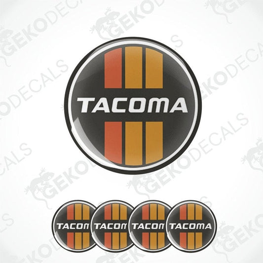 A set of round car decals with the text 'TACOMA' on them, displayed in a vertical arrangement.