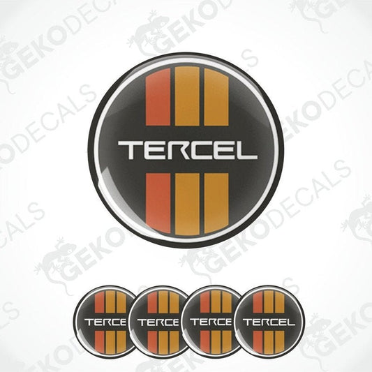A set of four round black vinyl stickers with the word 'TERCEL' and the Toyota logo in the center.