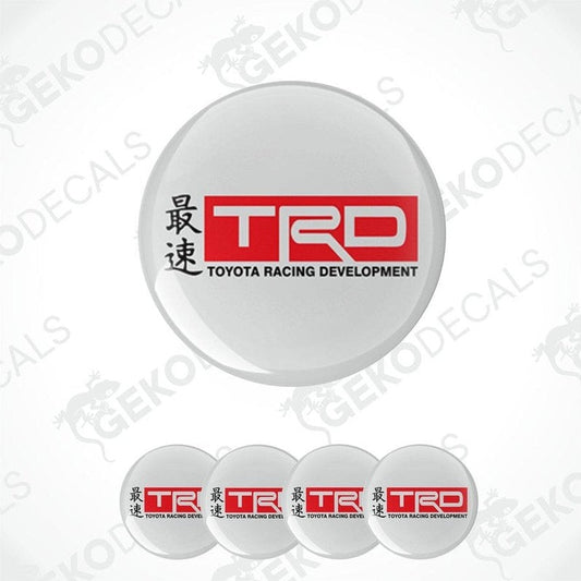 A set of four white vinyl stickers with the Toyota Racing Development logo in red and black.